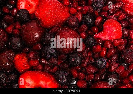 Colorful mix of assorted frozen berries ready for dessert preparation or smoothie crafting Stock Photo