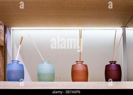 multicolored containers with sticks with different aromas and smells in the interior Stock Photo