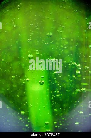 Close-up of air bubbles in soap bottle. Stock Photo