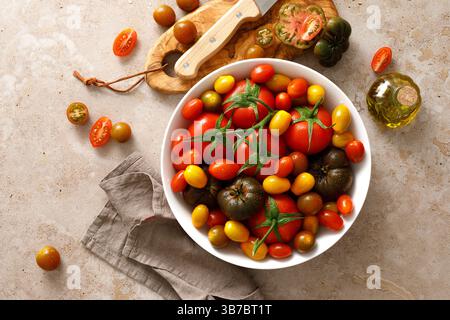 Fresh ripe cherry tomatoes and large red tomatoes, top view Stock Photo