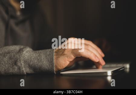 Close-up of a man's hand on a keyboard Stock Photo