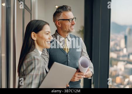 Successful Business Partners Engaging in Constructive Collaboration in a Modern Office Environment Stock Photo