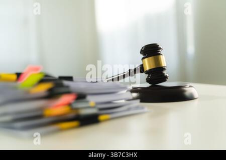 gavel and legal documents stacked books law in a library on legal documents Stock Photo