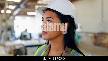 Thinking, woman and construction worker in workshop for project, planning or maintenance in building. Decision, brainstorming and Asian female Stock Photo