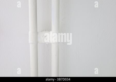 Modern and clean interior space featuring a well-lit room with functional design elements. The image showcases a minimalist hallway and bathroom area Stock Photo