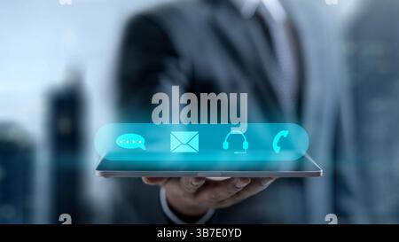 Businessman holding a tablet while showing a scheme icon of technical support on the screen. Technology innovation on a virtual screen. Concept of tec Stock Photo