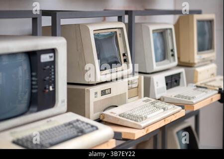 Pavia, Lombardy, Italy - March 13 , 2025: Vintage personal computers displayed on shelves at MUSDI Museum, showcasing the evolution of technology and Stock Photo