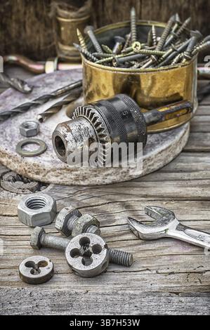 Set of old tools of the keys, screws and drills Selective focus Stock Photo