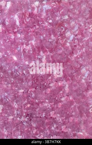 Lean minced beef sealed in a vacuum packed plastic wrap. Fresh meat in packaging background concept. Stock Photo