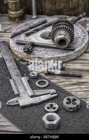 Set of old tools of the keys, screws and drills Selective focus Stock Photo