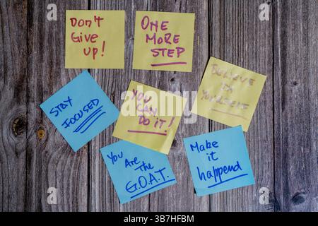 Colorful sticky notes with motivational messages inspiring perseverance and self-belief Stock Photo