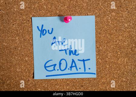 Greatest of all time goat appreciation note pinned on a cork board Stock Photo