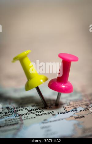 Two push pins marking locations on map of ukraine showing zaporizhzhia and mariupol Stock Photo