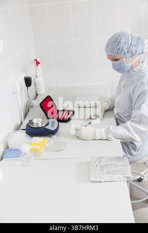 Doctror writes a note in the laboratory Stock Photo