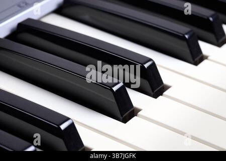 Midi keyboard keys close up shot. Piano keys buttons detail for musical design background Stock Photo