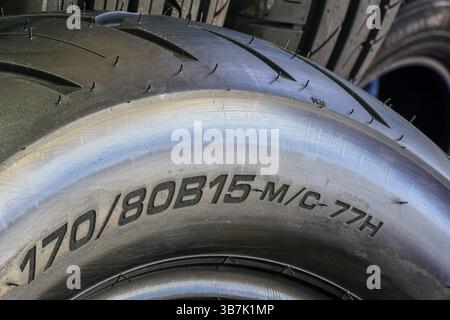 Road motorcycle rear tire size label on tire sidewall, width, height and diameter, big bike tire Stock Photo