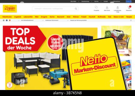 Stuttgart, Germany - February 8, 2025: Netto discount supermarket with online shop ecommerce on a mobile phone and website in Stuttgart, Germany. Stock Photo