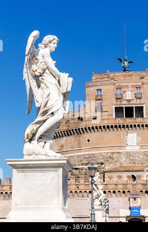 Historic Castel Sant'Angelo with ancient angel statues on Ponte Sant'Angelo portrait format in Rome, Italy Stock Photo