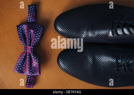 Men's shoes and bow tie. Wedding accessories and groom clothes Stock Photo