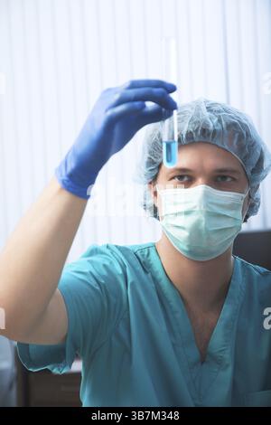Scientist doing DNA test in modern laboratory Stock Photo