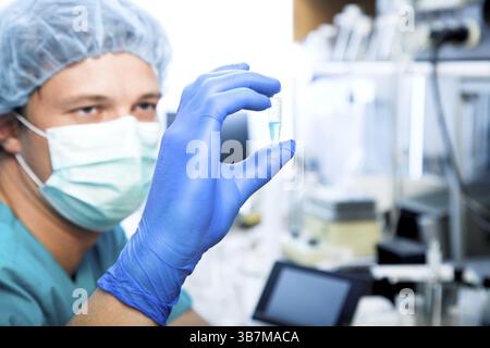 Scientist doing DNA test in modern laboratory Stock Photo