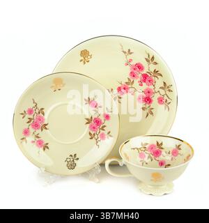 Porcelain vintage cup and saucer isolated on white background. Vintage Bavarian teaware. Stock Photo