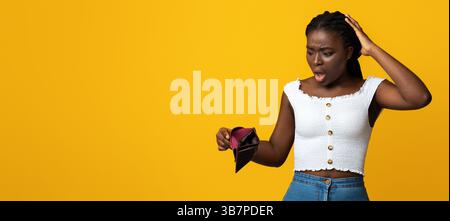 Oh No. Shocked Black Woman Looking At Empty Wallet In Her Hands Stock Photo