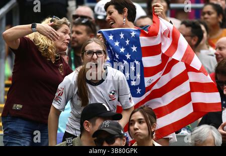 April 5, 2024, Hong Kong, China: American fans cheer for the US Men's Rugby Team at the Hong Kong Stadium, displaying the American national flag in Hong Kong, China. The Annual Hong Kong Sevens 2024 kicked off today at the Hong Kong Stadium. (Credit Image: © Liau Chung-ren/ZUMA Press Wire) Stock Photo