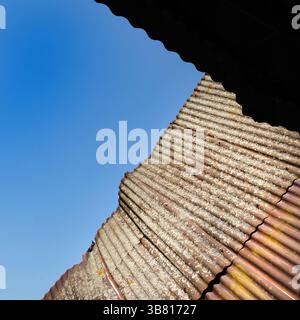 old abandoned corrugated panels for roofing industrial buildings Stock Photo