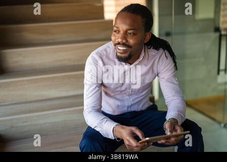 Happy software developer man working on project. Programming advanced code artificial intelligence Stock Photo