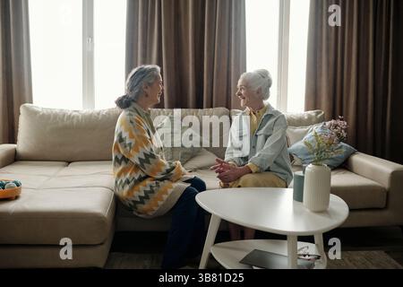 Two Elderly Women Having a Friendly Conversation Stock Photo
