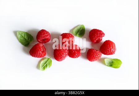 Group of fresh raspberries isolated on a white background. Healthy food. Directly above. Stock Photo