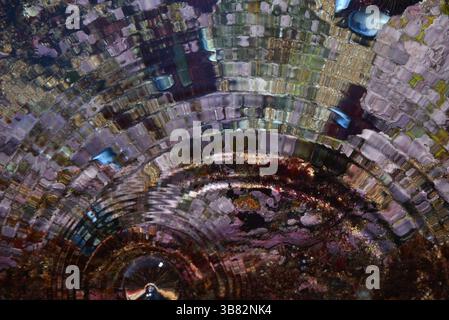 Wave propagation and interference with light refracted by agus movement on a purple background Stock Photo