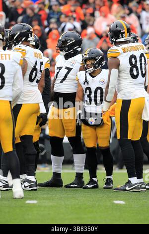 Commandres Running Back Pittsburgh Steelers running back Jaylen Warren (30) falls to the turf ...