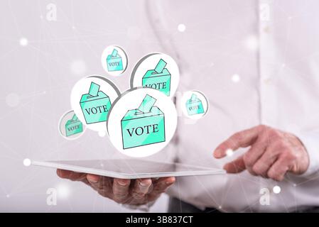 Vote concept above a tablet held by a man in background Stock Photo