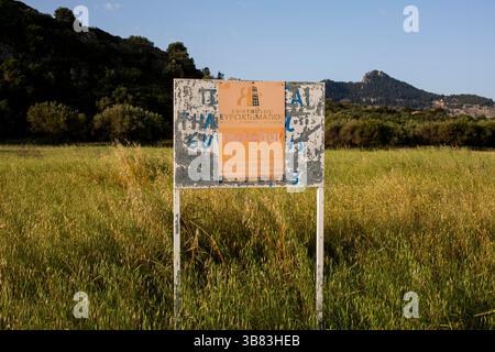 A ‘for sale’ sign on an empty plot of scenic land in Kolymbia, on the island of Rhodes in Greece, April 2025. Stock Photo