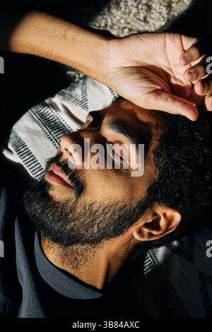High angle view of man sleeping on pillow at home Stock Photo