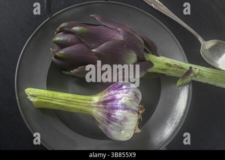 Artichoke in pewter bowl Stock Photo