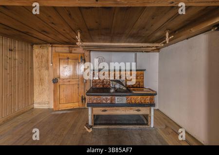 The living room with tiled stove in a house built around 1750 that has since been demolished. Menznau, Lucerne, Switzerland, Europe Stock Photo