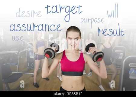 Young adult fitness woman doing swing exercise with a kettlebell as a part of a fitness workout Stock Photo
