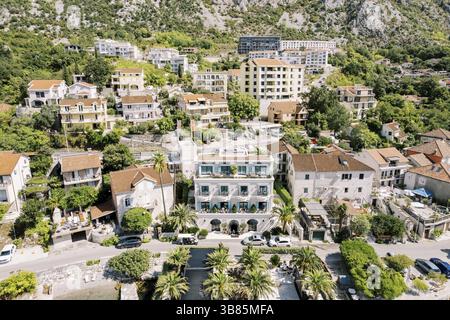 Luxurious Forza Terra hotel next to ancient villas. Dobrota, Montenegro. Drone., Ð§ÐµÑ€Ð½Ð¾Ð³Ð¾Ñ€Ð¸Ñ Stock Photo