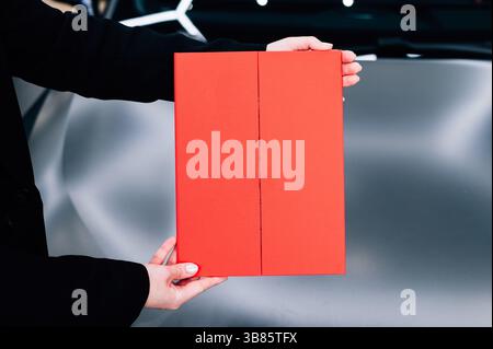 Red diploma award in hands. High quality photo Stock Photo