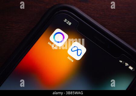 Meta AI and Meta app icons are displayed on an iPhone. Meta AI is Meta’s advanced conversational assistant, integrated into its own platforms. Stock Photo