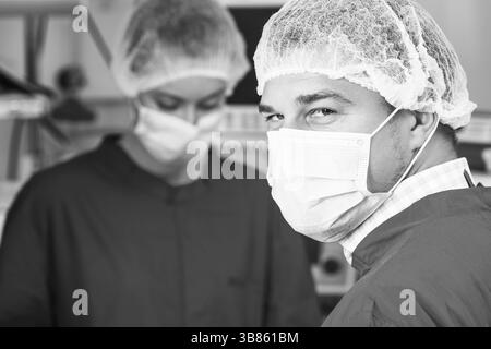 Attentive look of surgeon in operation room Stock Photo