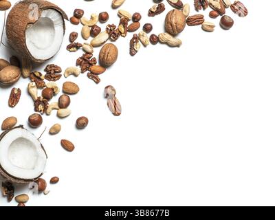 Background of mixed nuts - coconut, hazelnuts, walnuts, almonds, pecan, pistachio, brazil nut, pine nuts, peanut - with copy space. Isolated one edge. Stock Photo