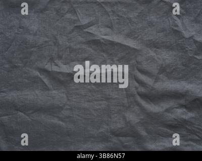 Gray linen texture as background. Gray linen crumpled tablecloth. Can use as mock up for design. Copy space for text Stock Photo
