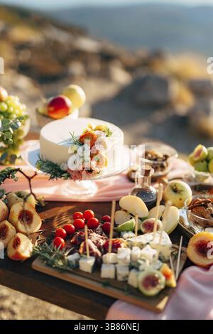 White wedding cake on a set table. Stock Photo