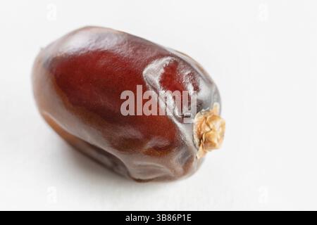 Close-Up Of Dry Date Fruit Over White Background Stock Photo
