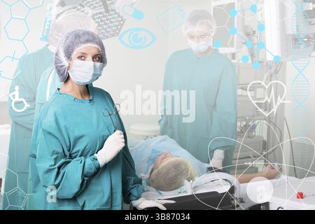 Team of surgeon in uniform perform operation on a patient Stock Photo