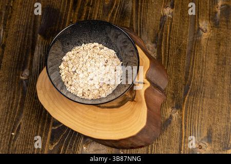 oatmeal porridge with berries, filled with instant oatmeal porridge with additives, close up Stock Photo